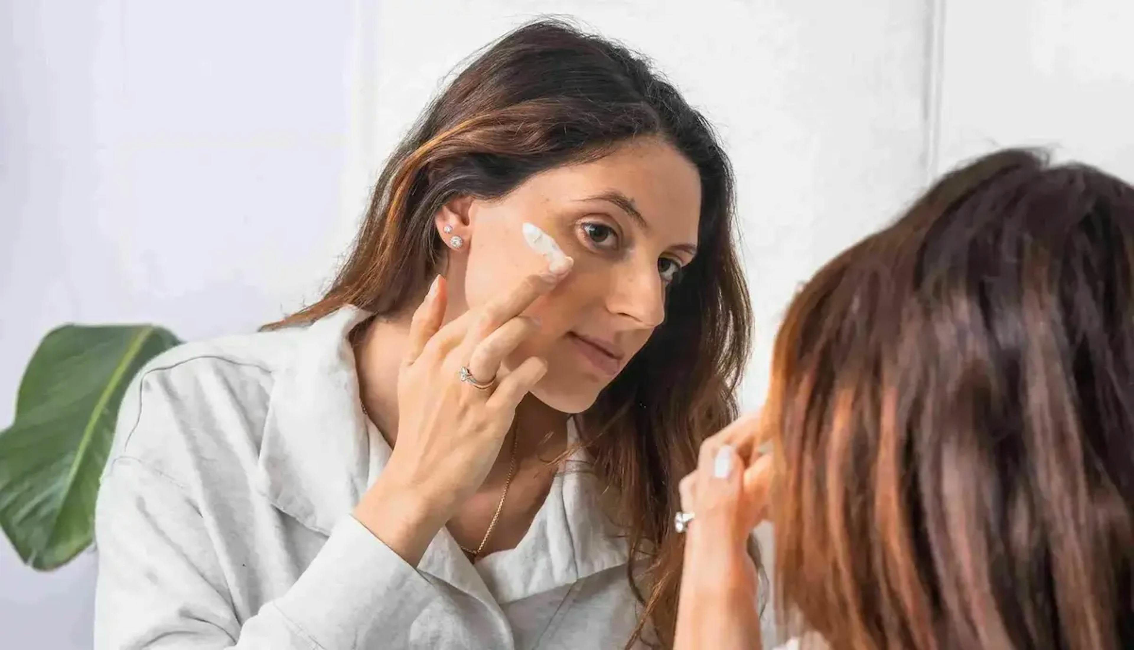 Applying cream on the face