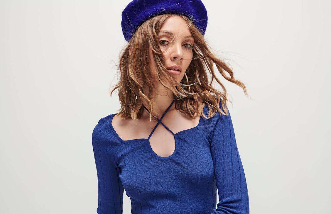 Female model wearing the disco top in baddie blue.