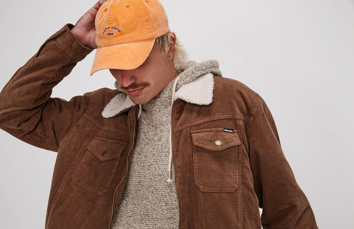 Male model wearing the Petey Jacket in bark.