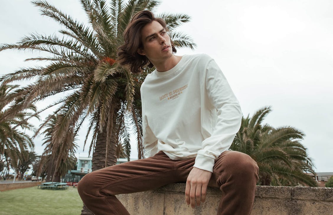 Male model wearing the Common Long Sleeve in Ivory