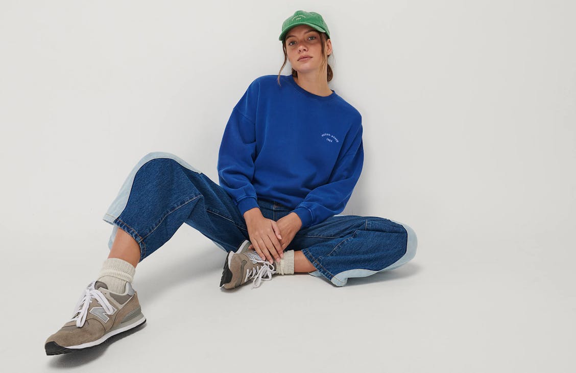 Studio image of model wearing the Cool Crew, Wave Jeans and a Classic Cap