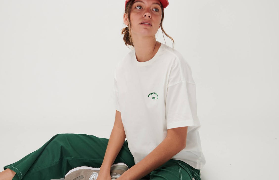 Female model wearing the Cool tee in white.