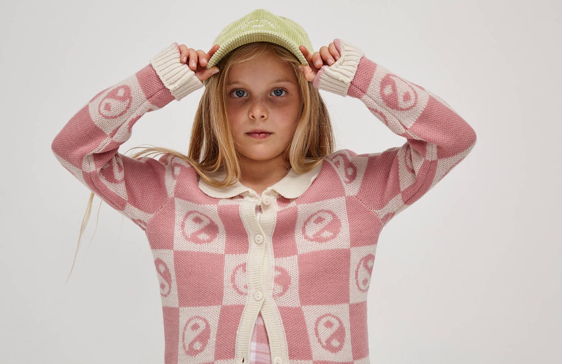 Young female model wearing the Martha cardi in lippy pink 