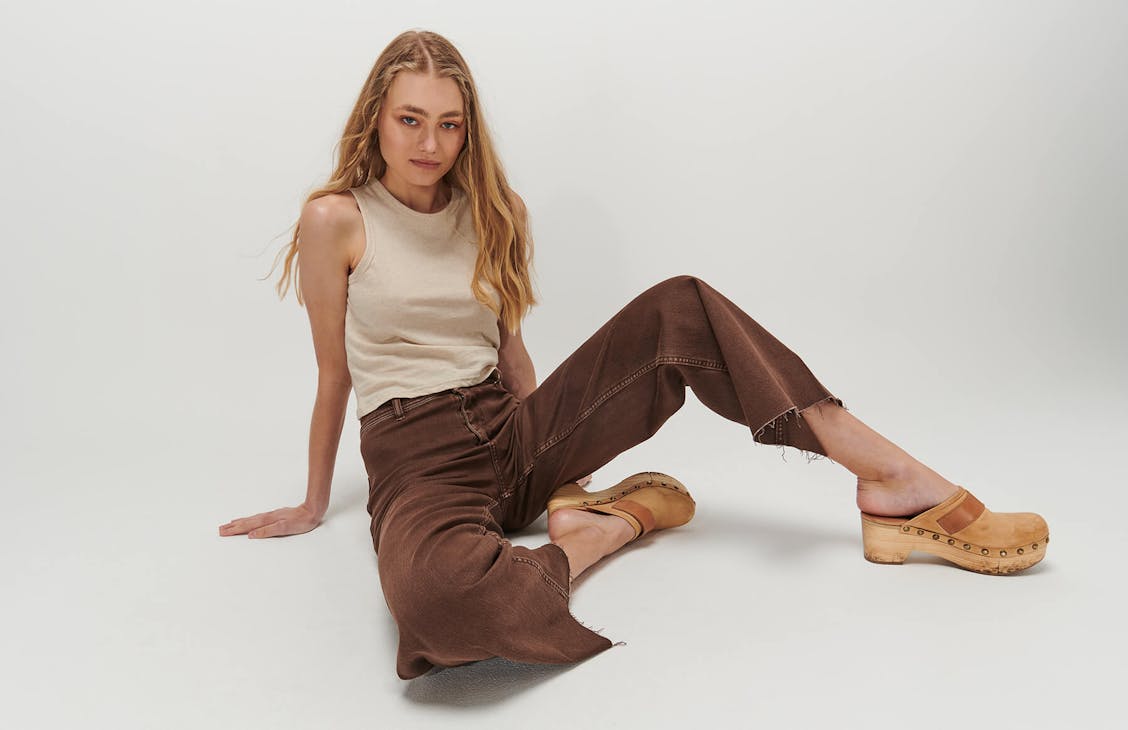 Female model wearing the Bleeker Pants in chocolate