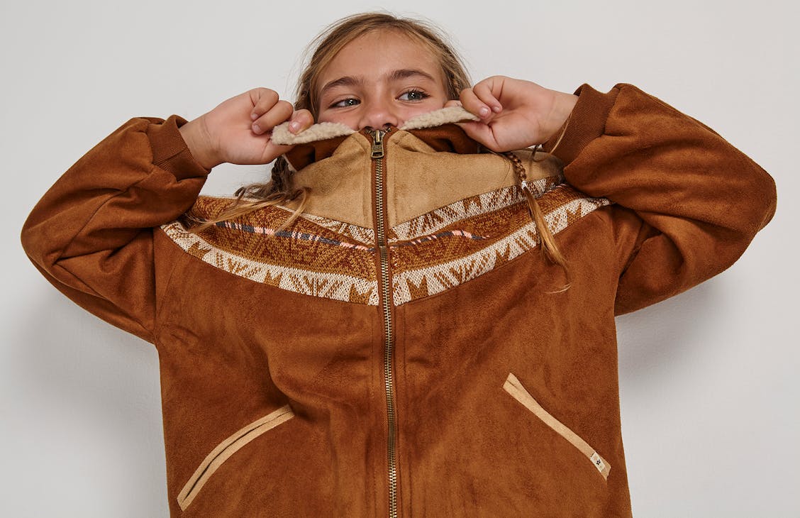 young female model wearing the yellowstone jacket in Yellowstone.