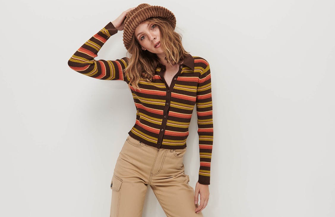 Female model wears the millie top in Jaffa stripe. 