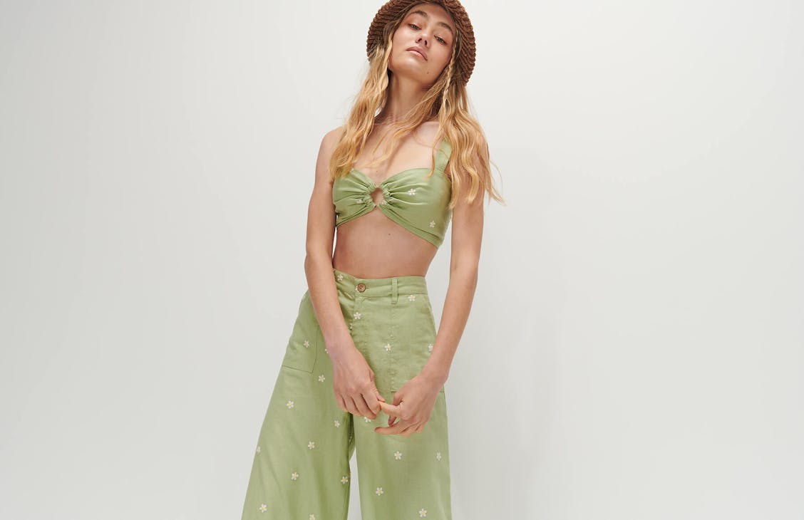 Female model wearing the Emmy top in avocado. 