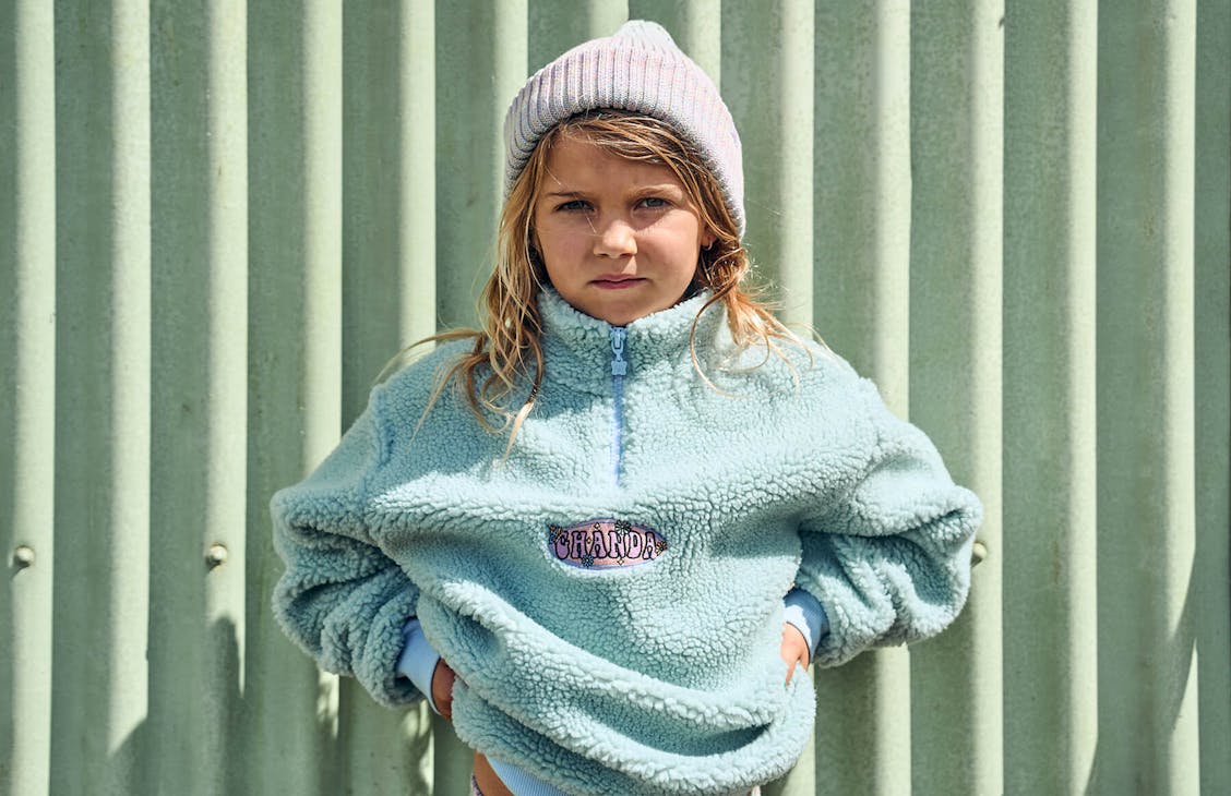 Young girl model wearing the Washed Sherpa Crew in Duck Egg.