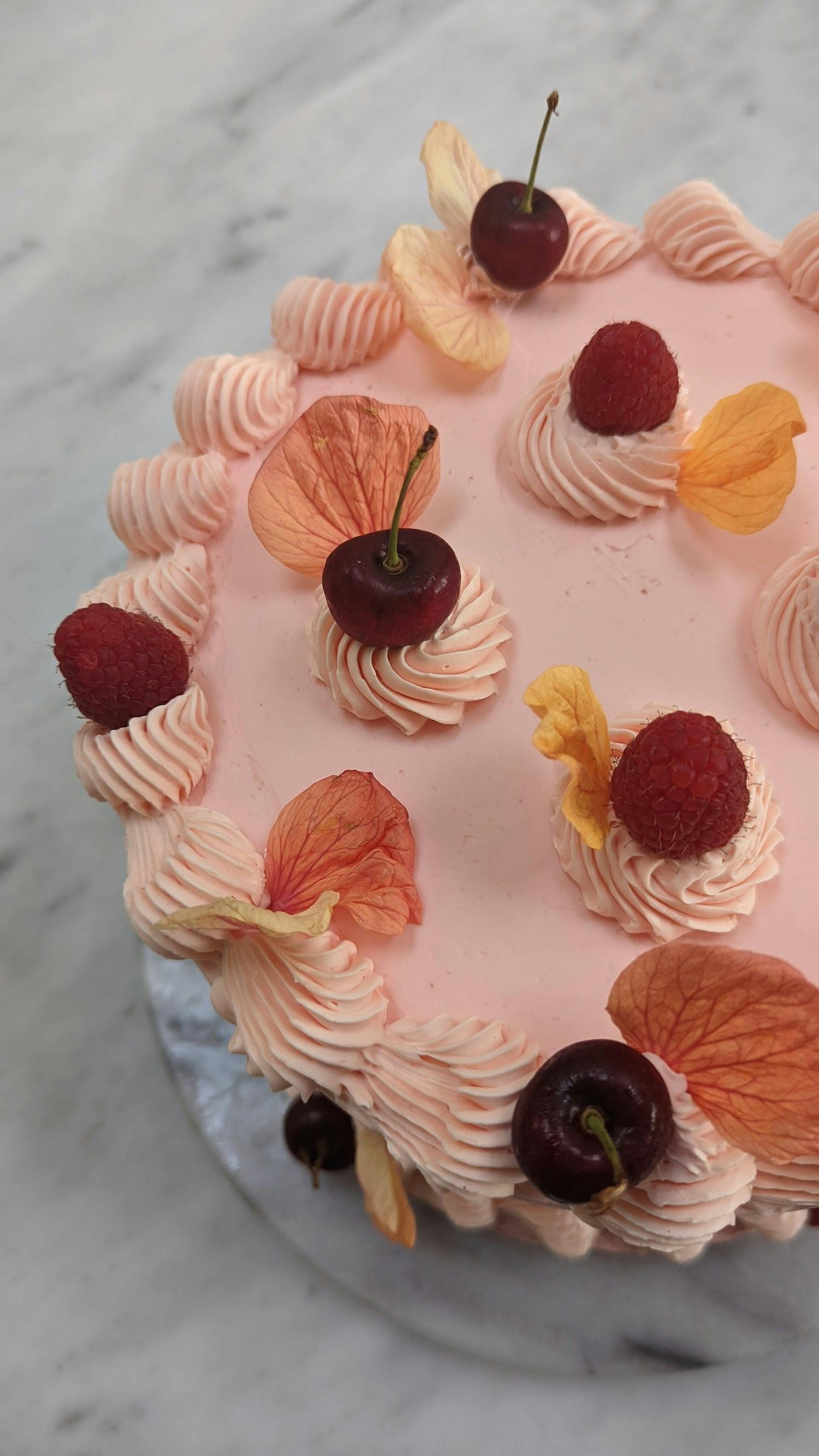Pink cake with cherries