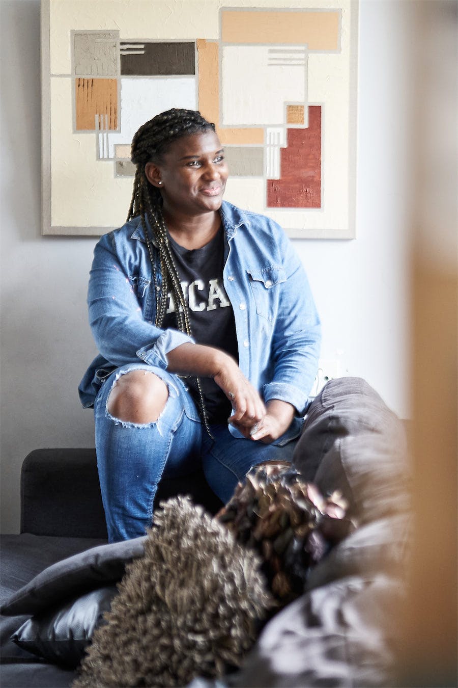 Yvette Miller seated in her studio