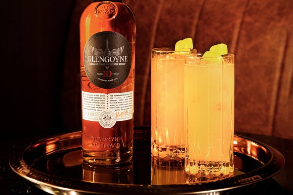 Bright Yellow Cocktail with Glengoyne Bottle. The Honeybee cocktail.