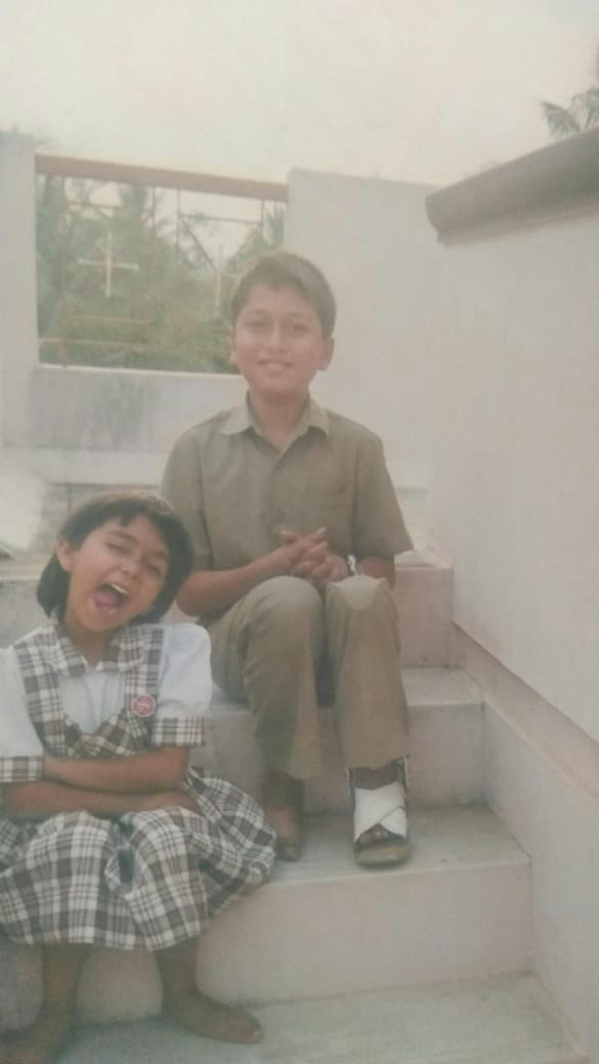 Two kids in school uniforms