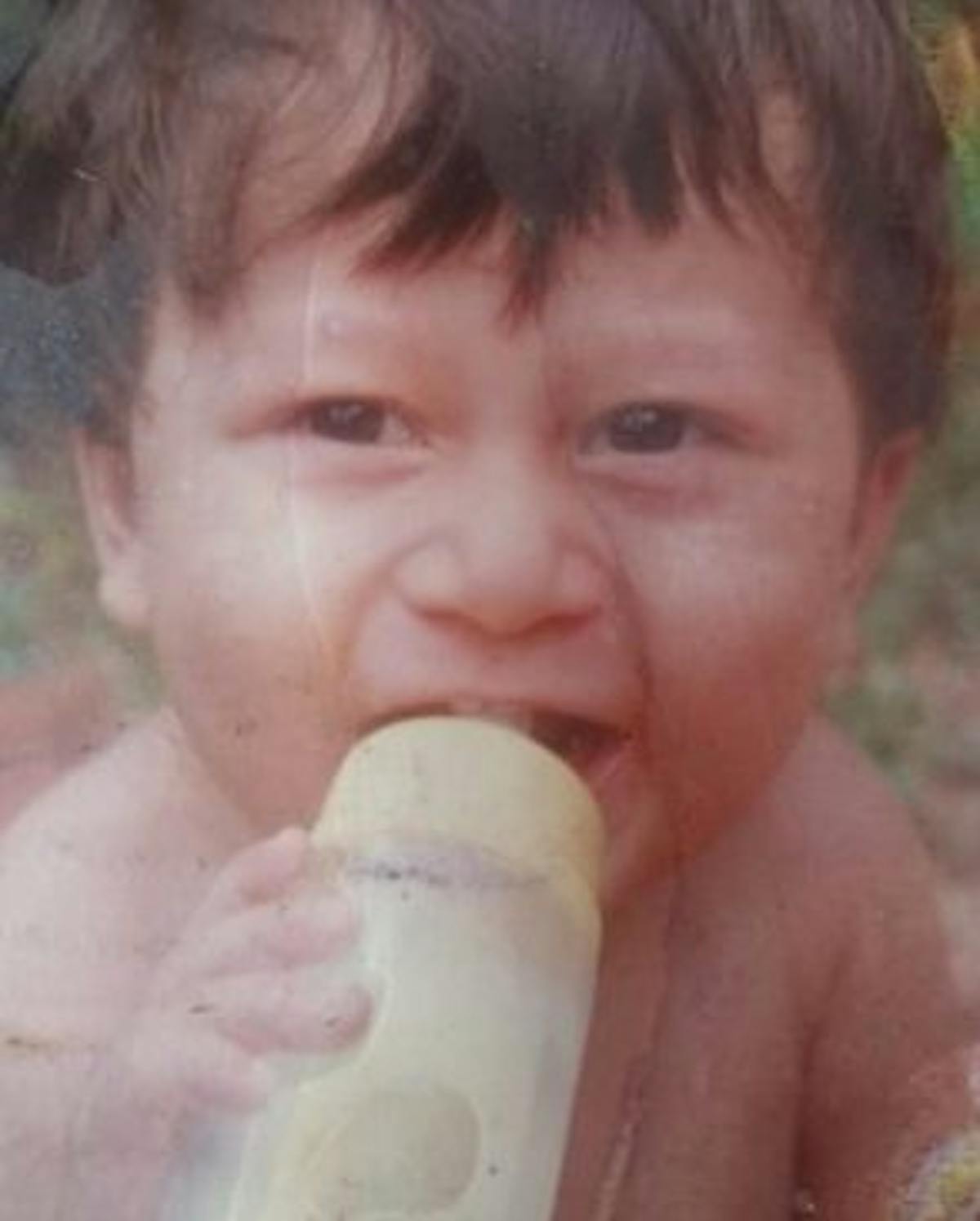 Baby with feeding bottle