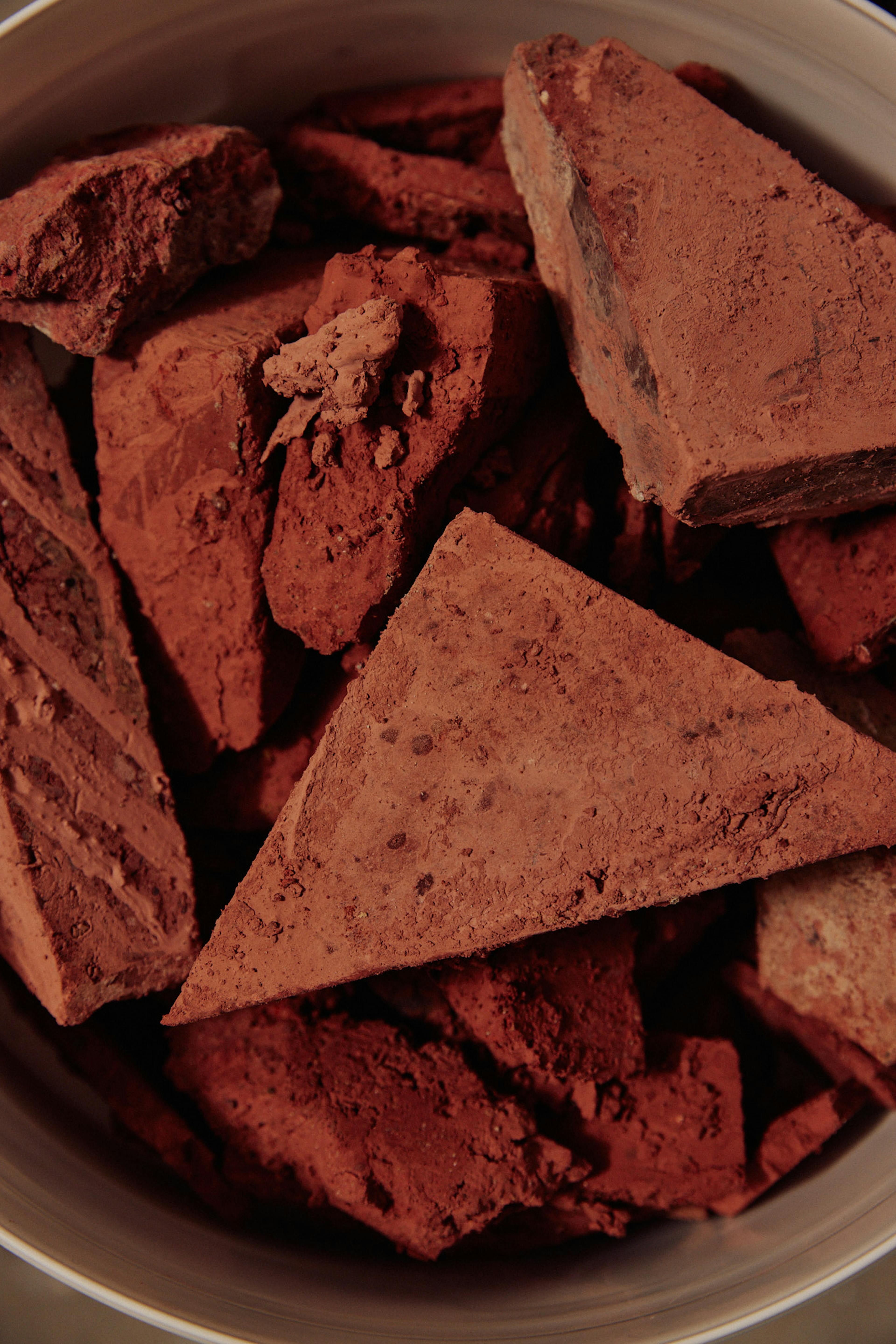 The image shows red brick chunks and red terracota brick dust. 