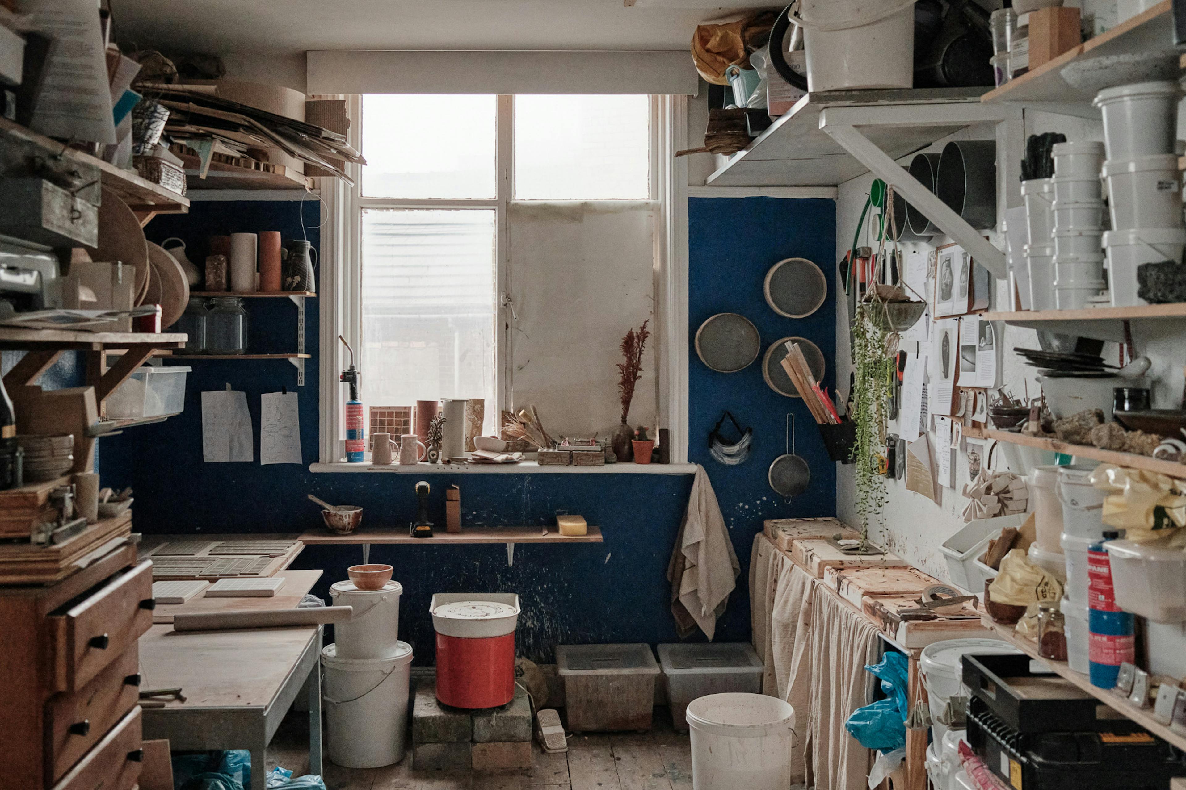 A show of a beutiful ceramic studio. Full of charm and utensils. 