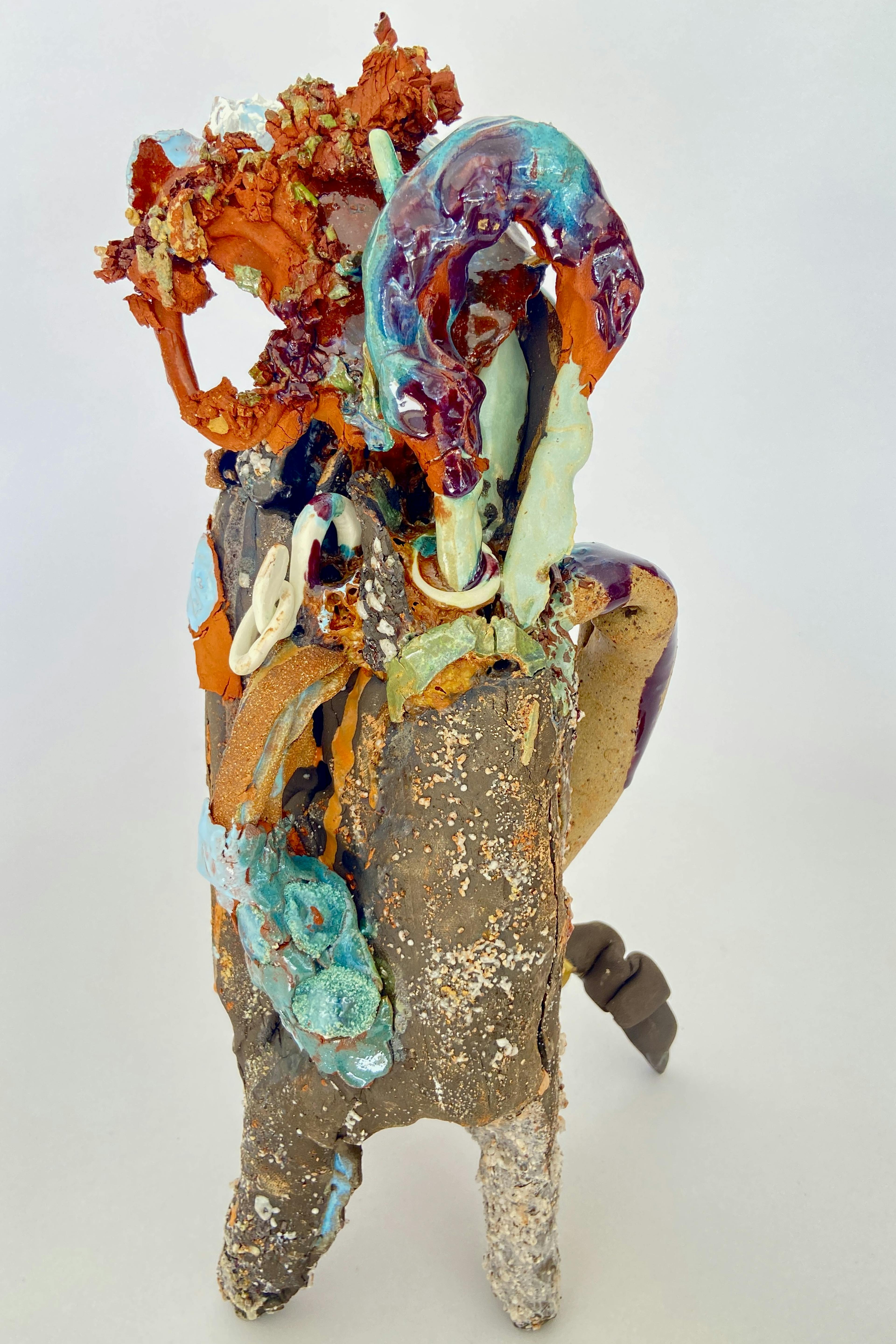 An image showing a ceramic sculpture by Julie Ellen Lancaster. It has multiple colours and textures. 