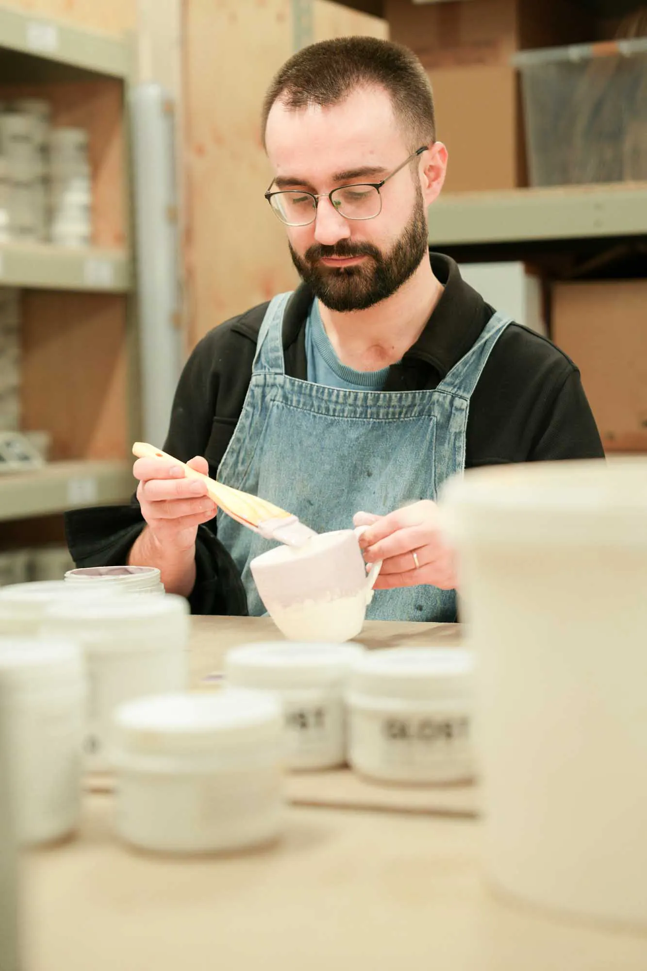 glazing a mug with brush on glaze