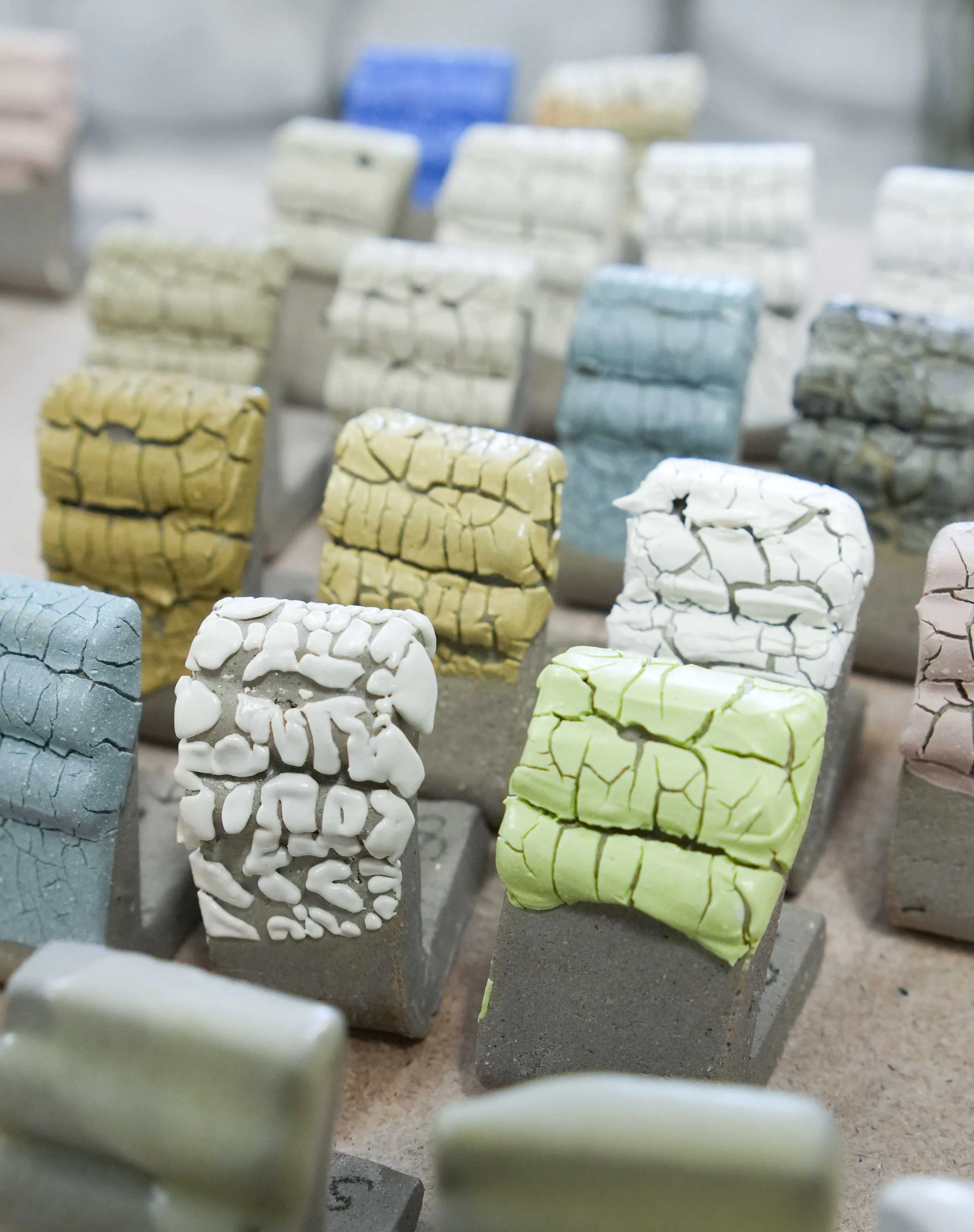 Crawl glaze test tiles form students attending a workshop