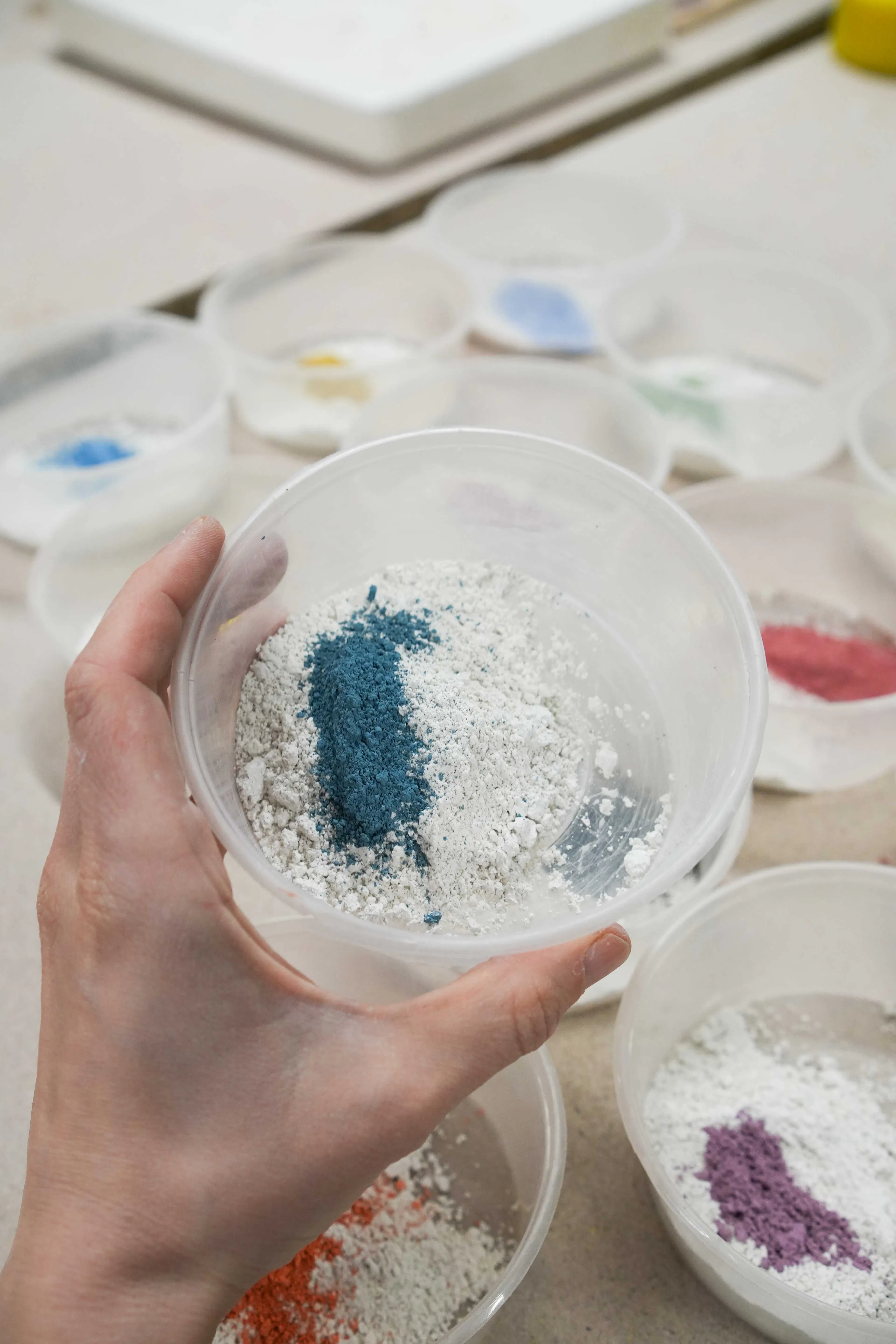 powdered ceramic stain in a cup before mixing