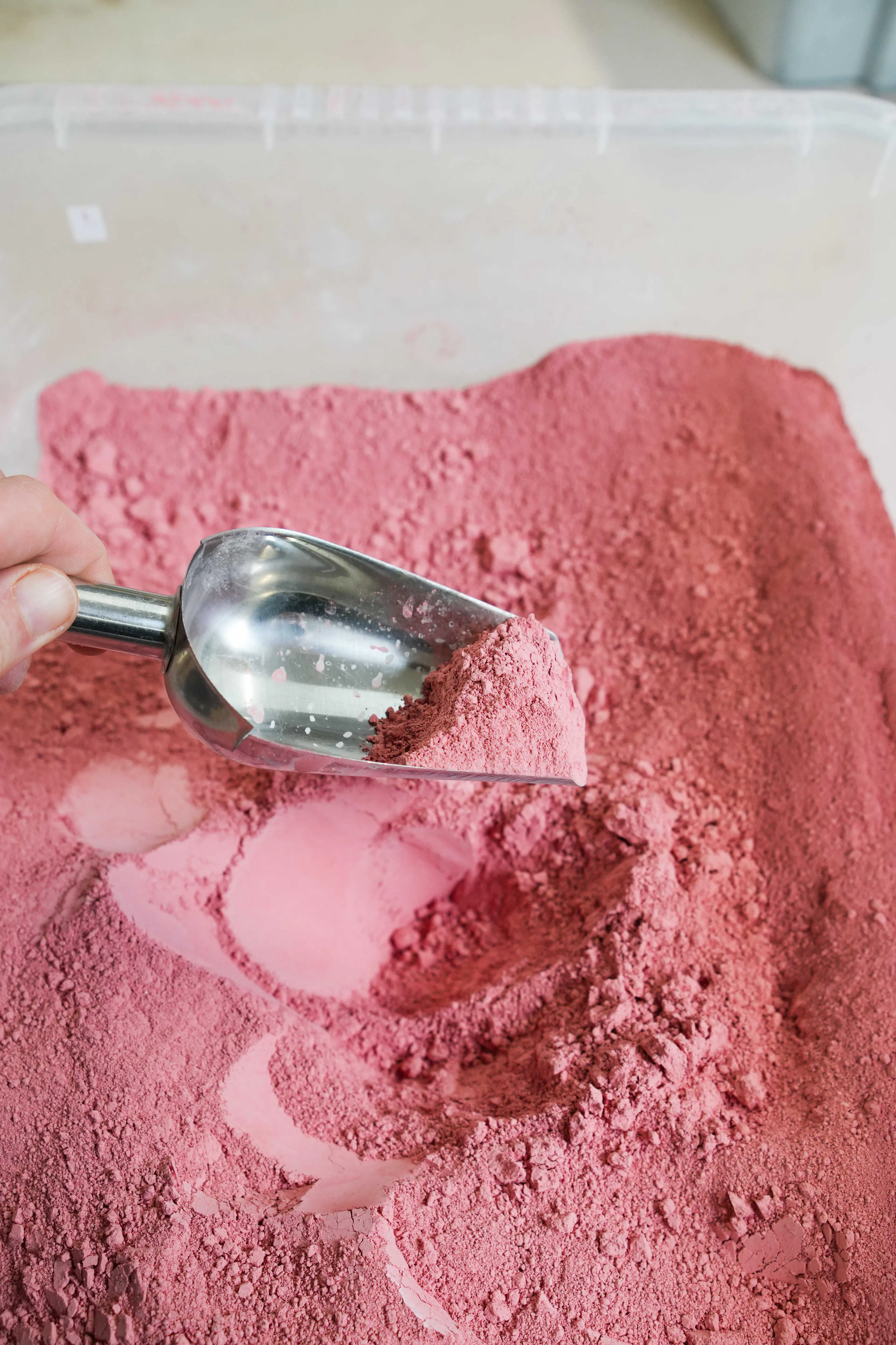 red ceramic stain and a scoop