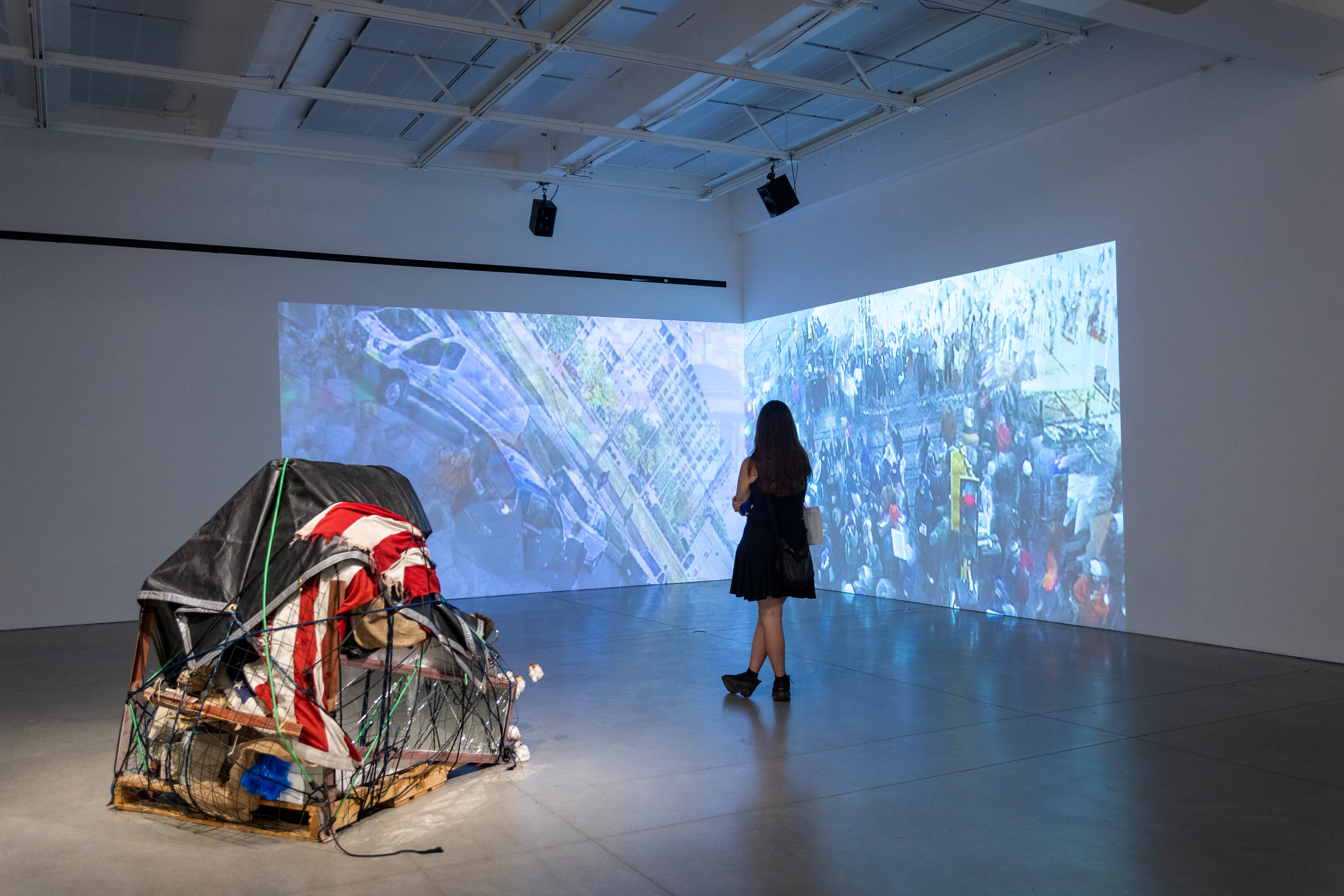 A women views a large-scale digital art piece in the New Wight Gallery at UCLA