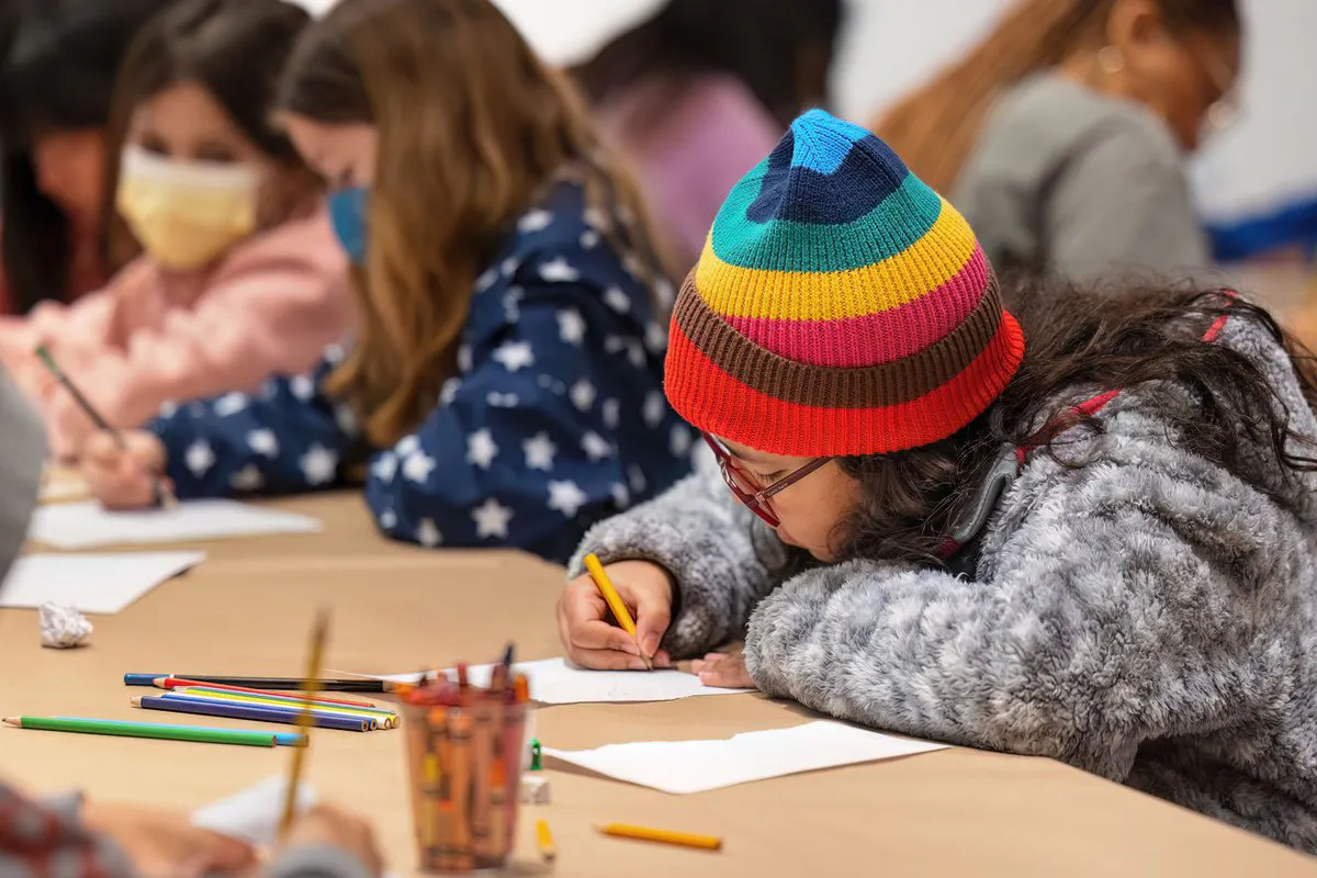 Kids write on paper