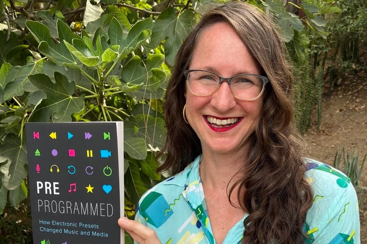 Portrait of Amy Skjerseth, posing with her book