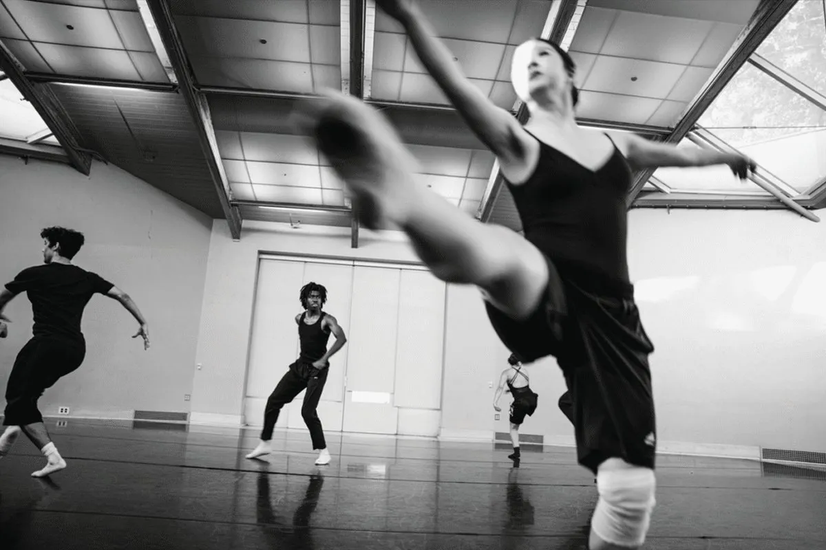 Black and white shot of a ballet dancer with the subject blurred in motion.