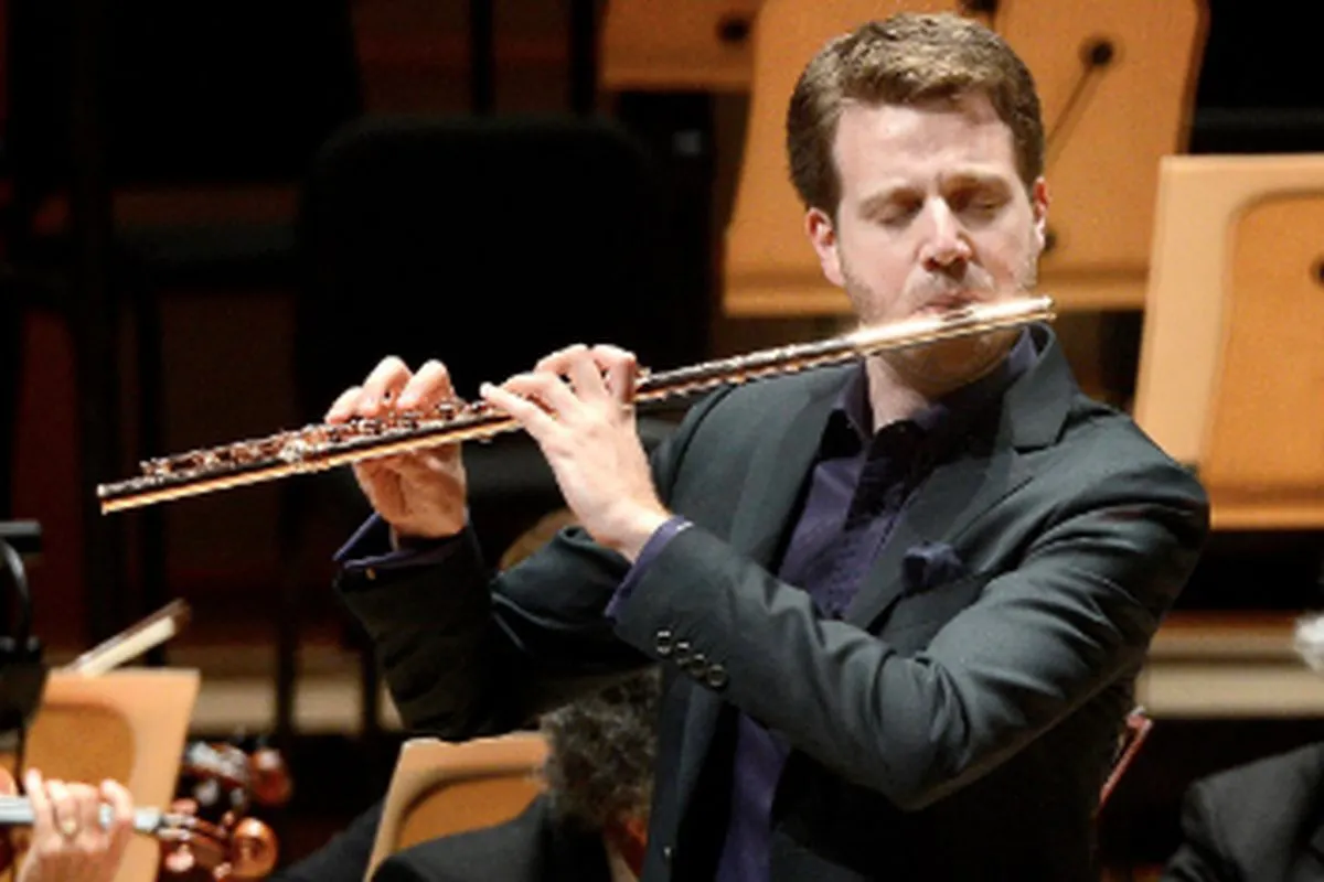 A flute performer on stage