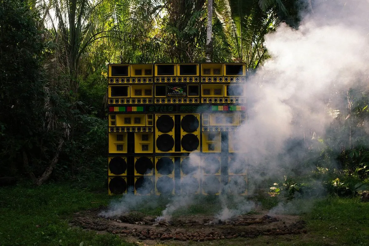 A wall of yellow speakers, surrounded by smoke