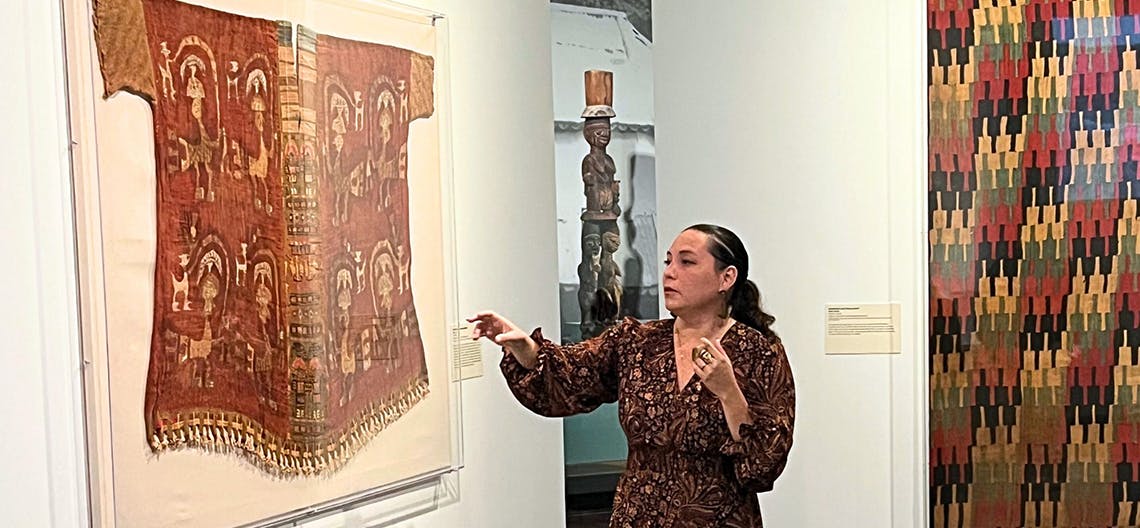 Solsiré Cusicanqui discussing her art at a museum