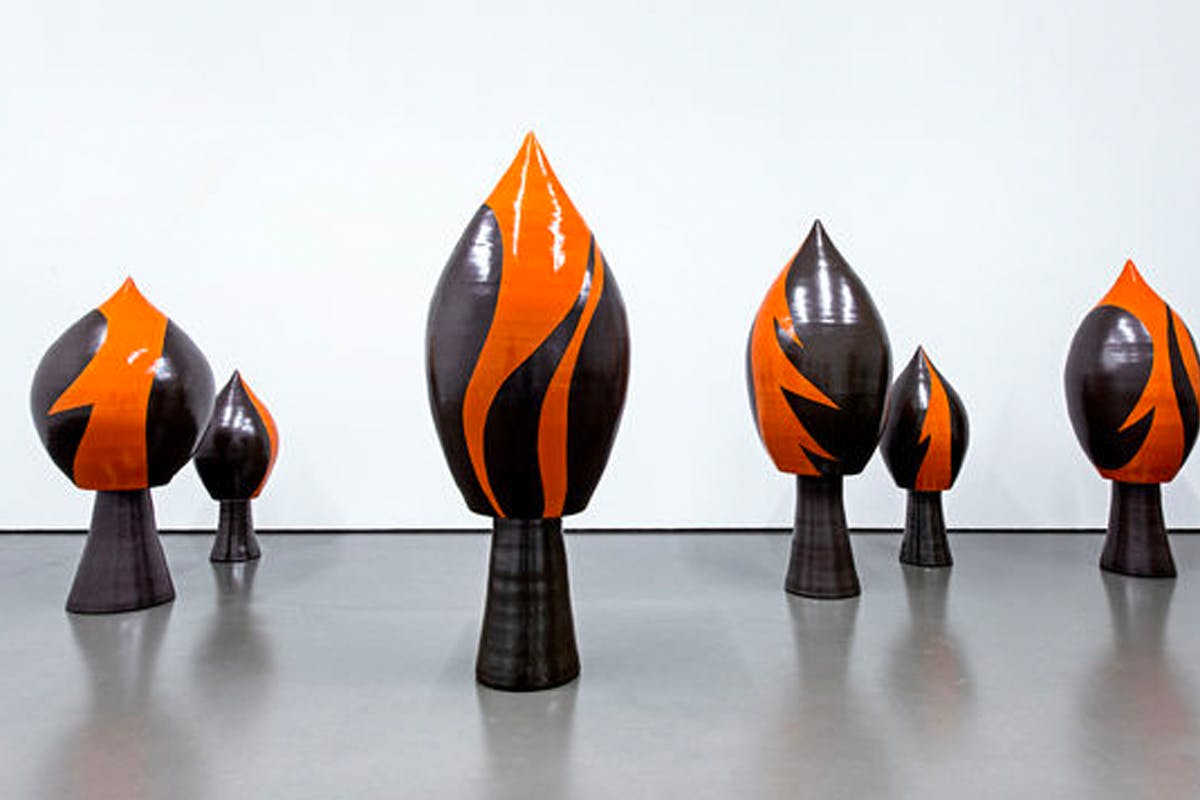 orange and black sculpture cones