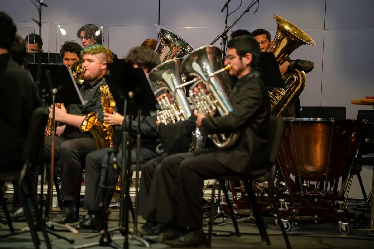 A group of brass performers onstage