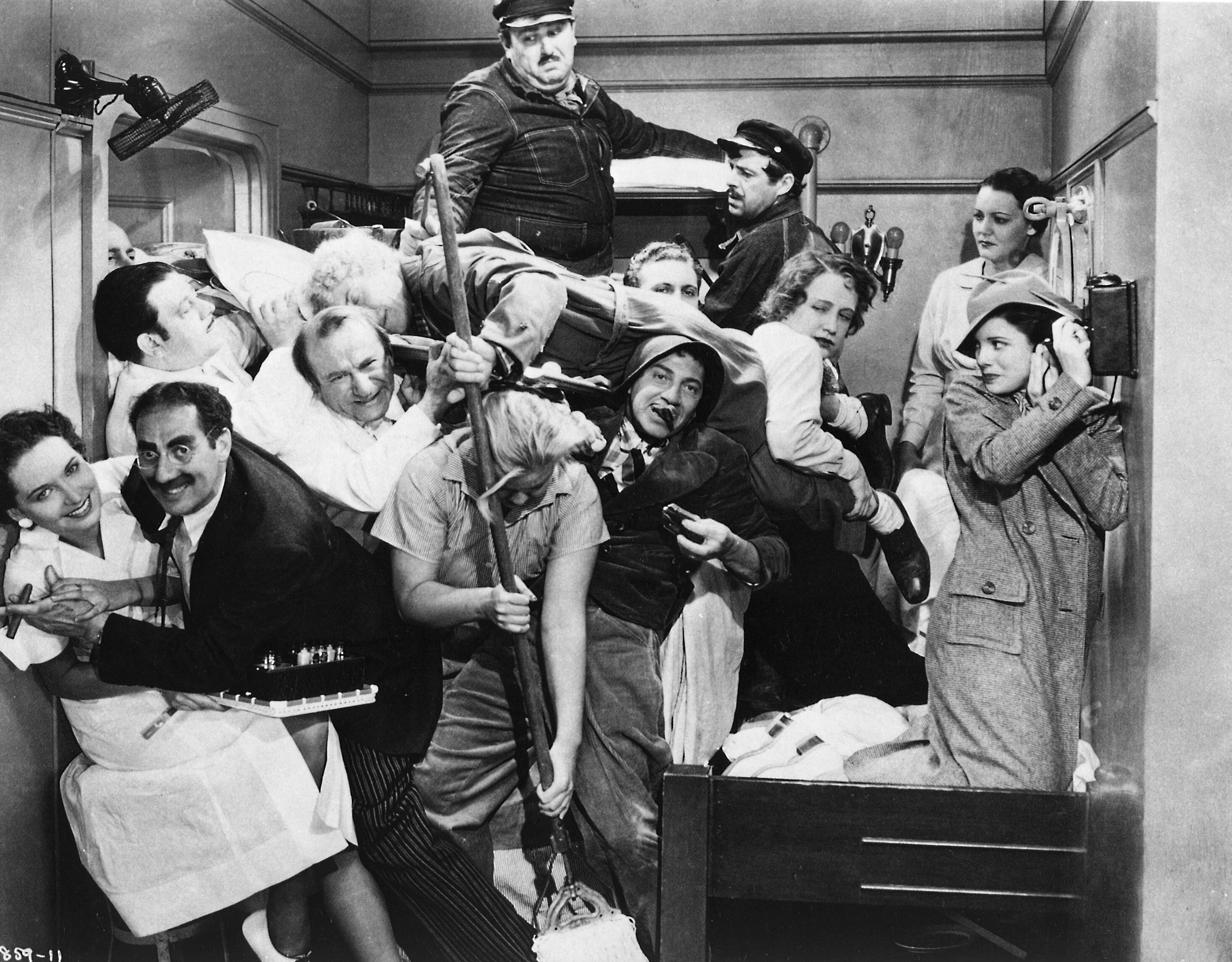 A group of people all crammed together in a small space 