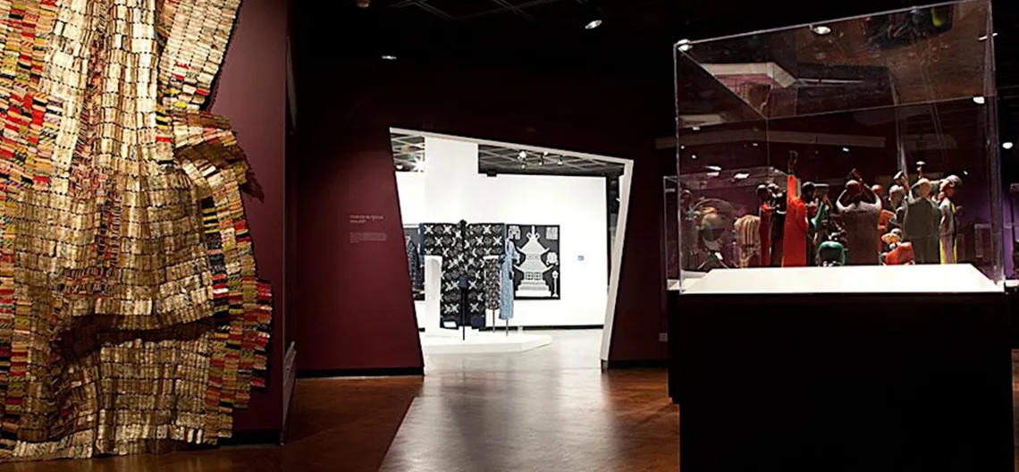 View of the galleries in the Fowler Museum with various kinds of art and sculpture on display.