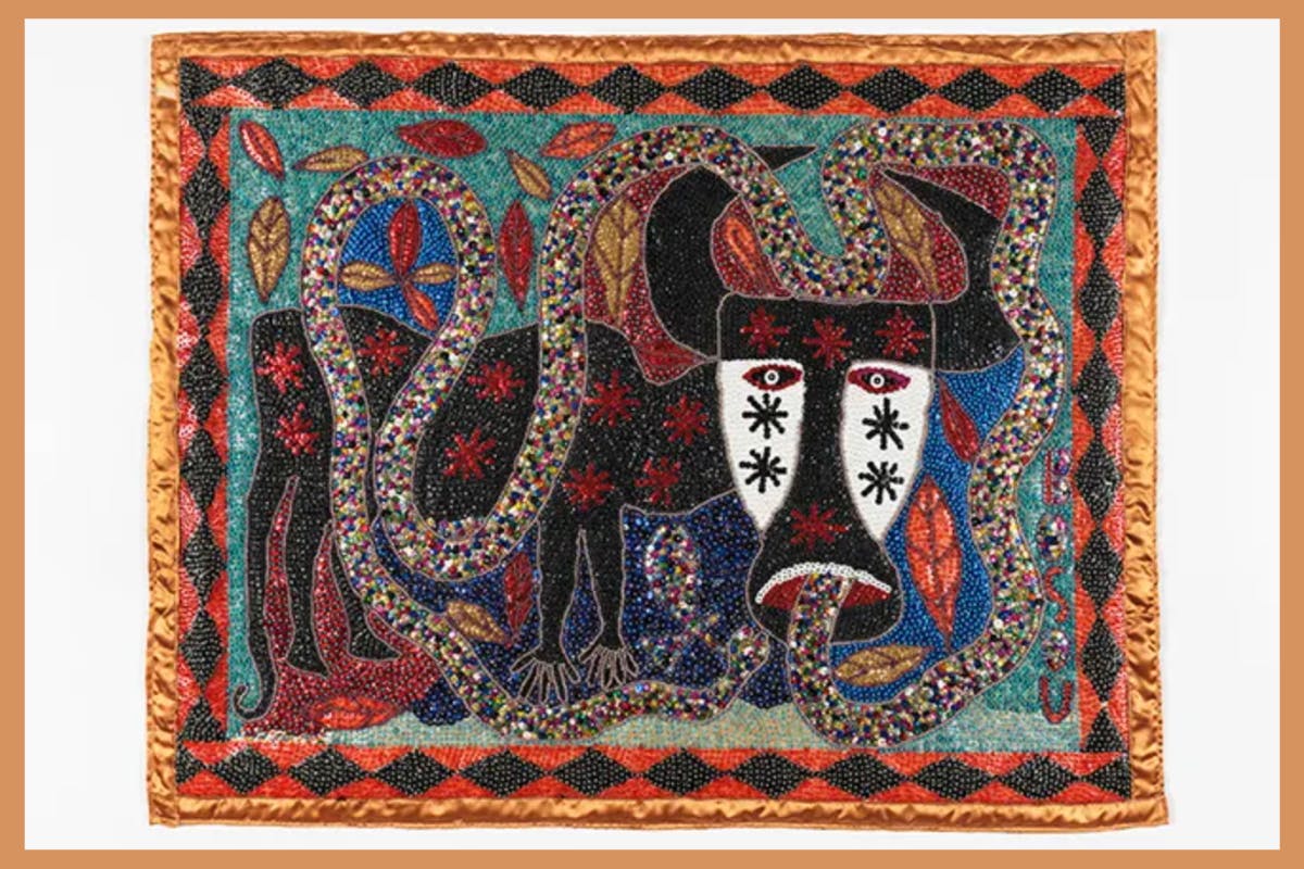 Image of a piece of beaded textile art with a bull motif.