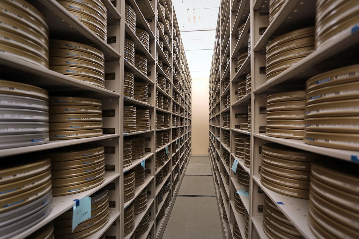 long view of film canisters in library stacks