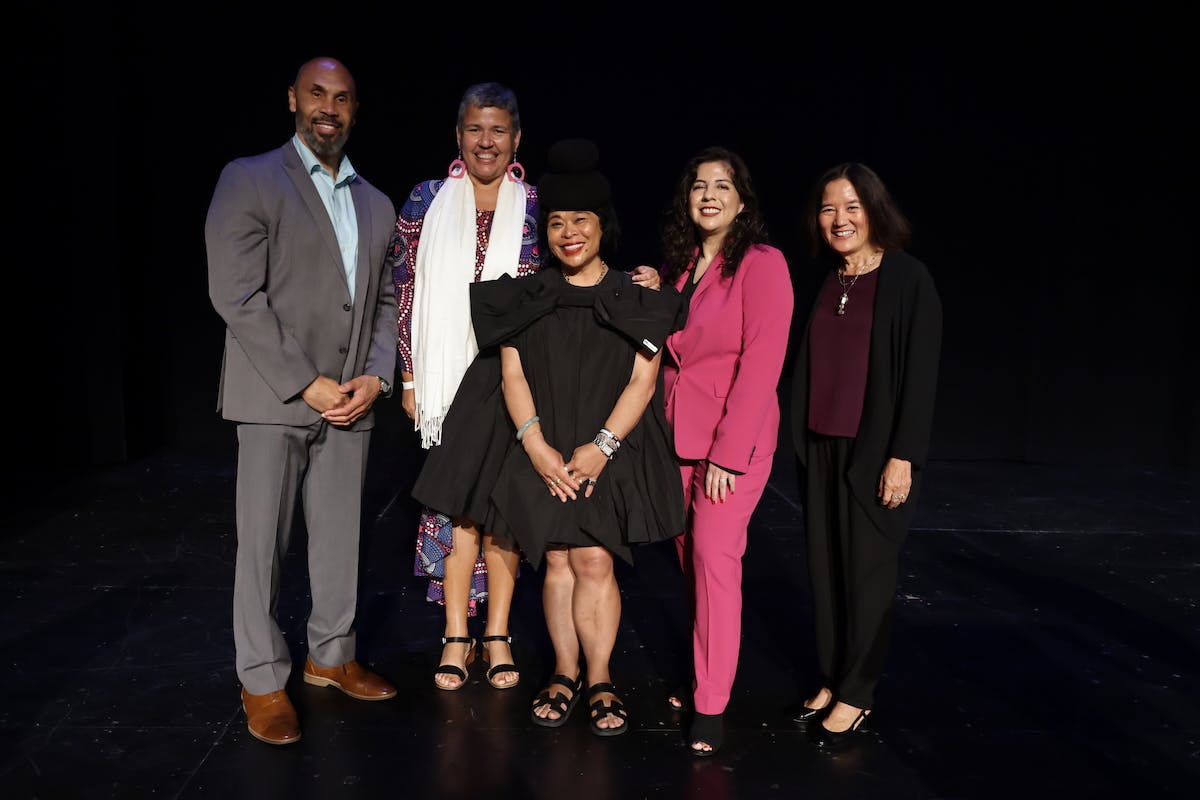 Group shot of Darnell Hunt, Josslyn Luckett, Celine Parrenas Shimizu, Ana-Christina Ramon and Elizabeth Whitney on a darkened stage. 