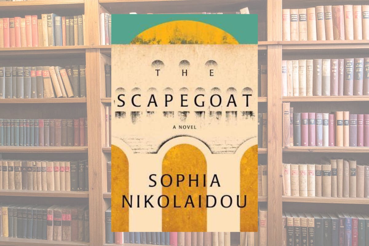 book cover of The Scapegoat on a background image of a full bookshelf