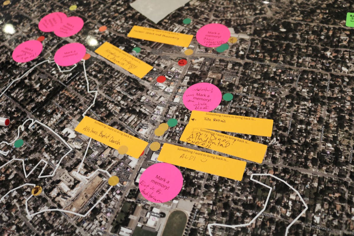 People have placed sticky notes on a detailed map of Altadena, offering memories and hopes for rebuilding