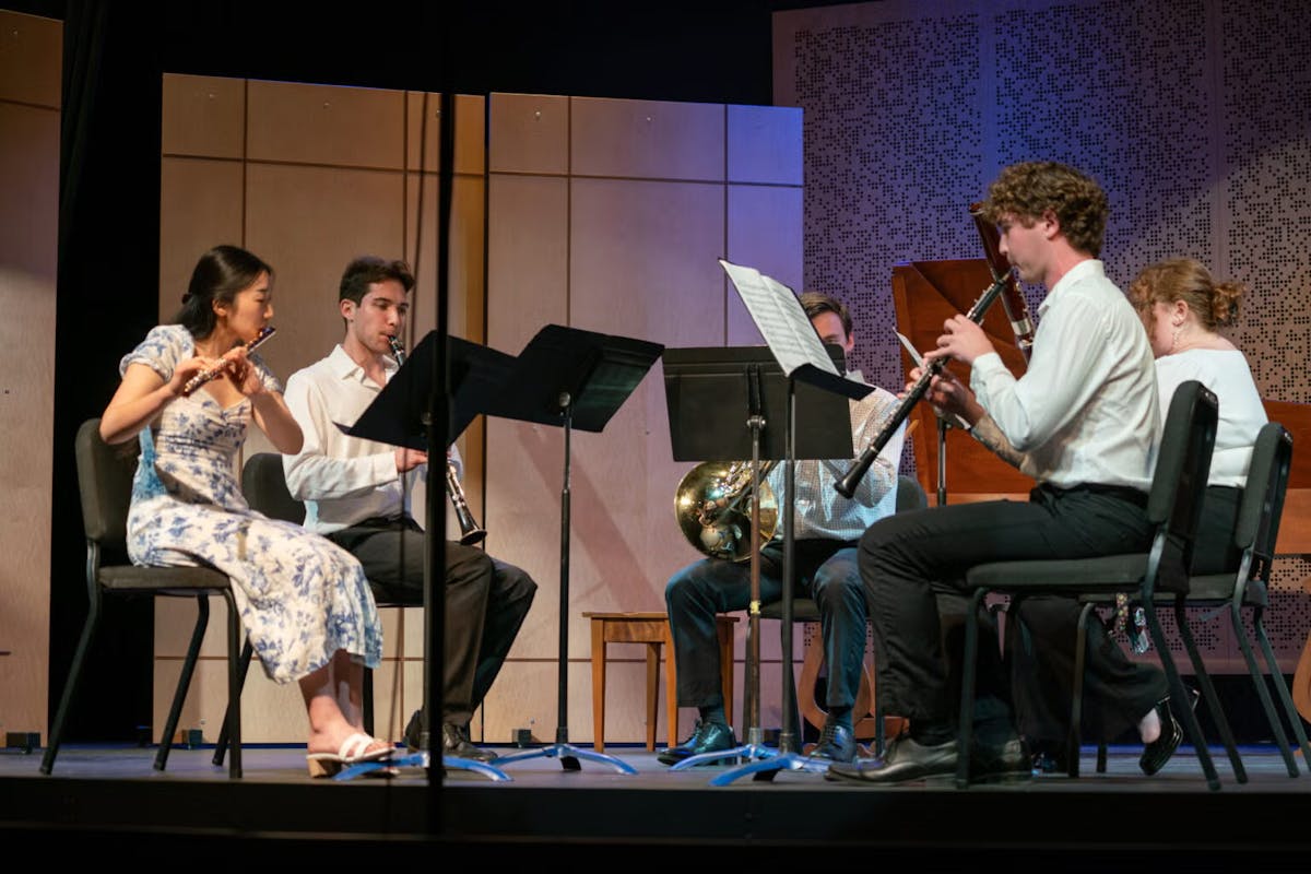 a woodwind quartet performs on stage