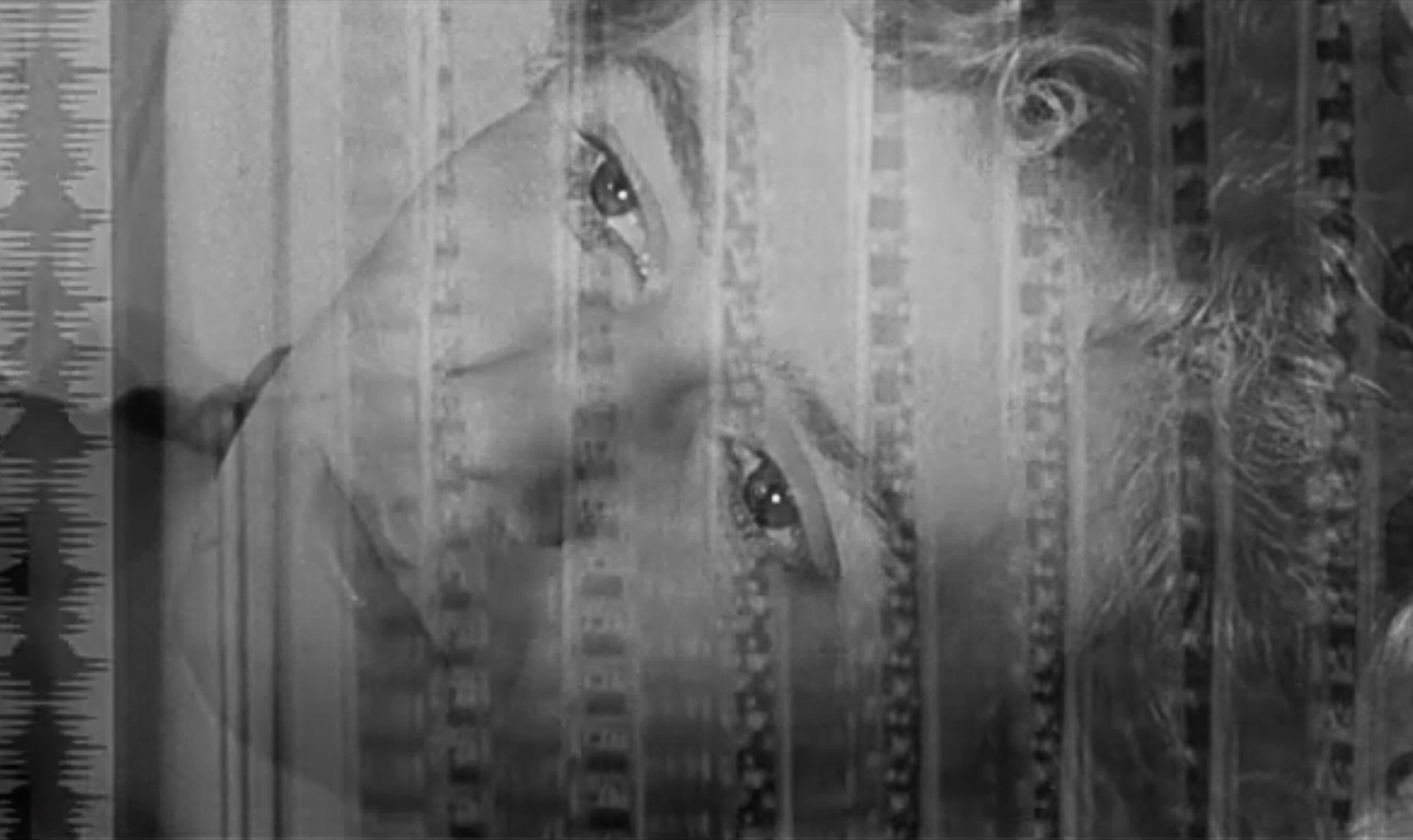 closeup on woman's face behind a veil-type curtain
