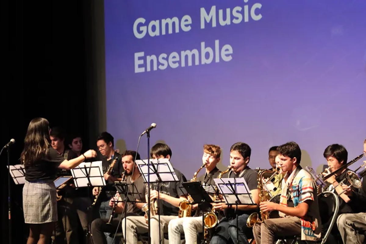 A group of musicians perform onstage