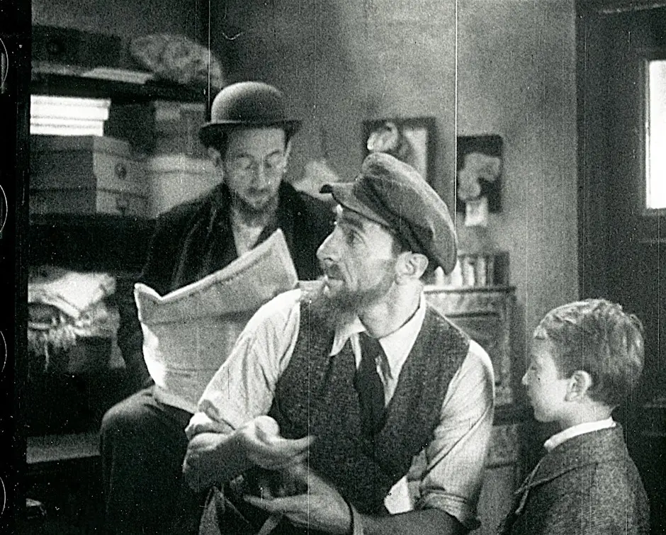 Image of two men and a child from the "Jolly Paupers" film.