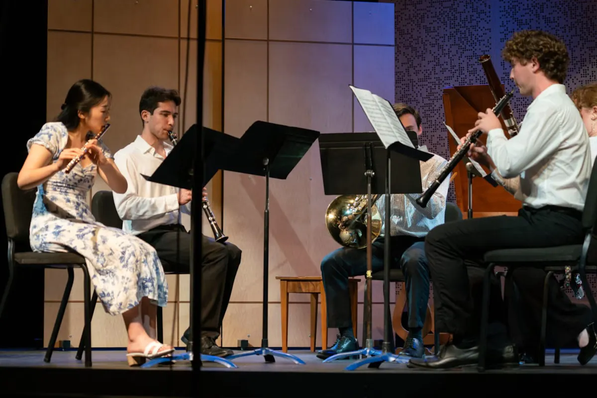A woodwind quintet playing on stage.