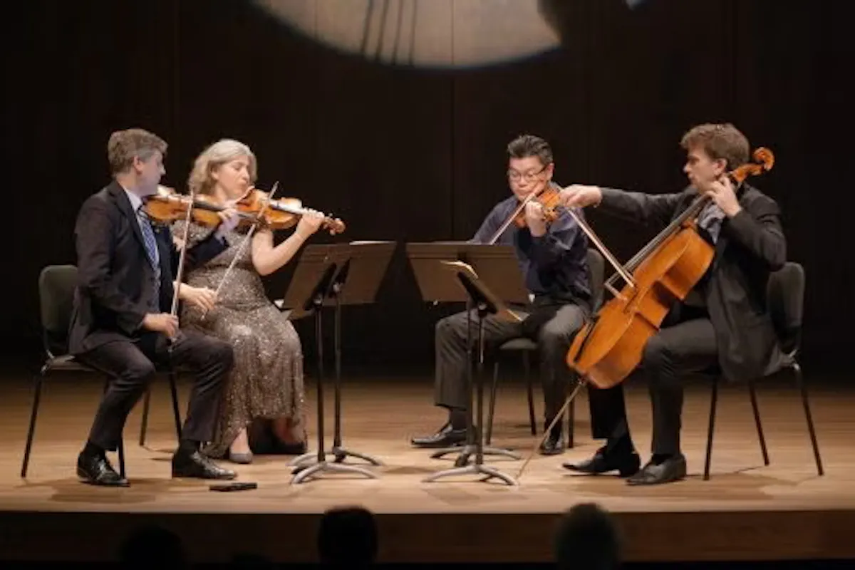 the Ehnes string quartet sitting on stage, rehearsing.