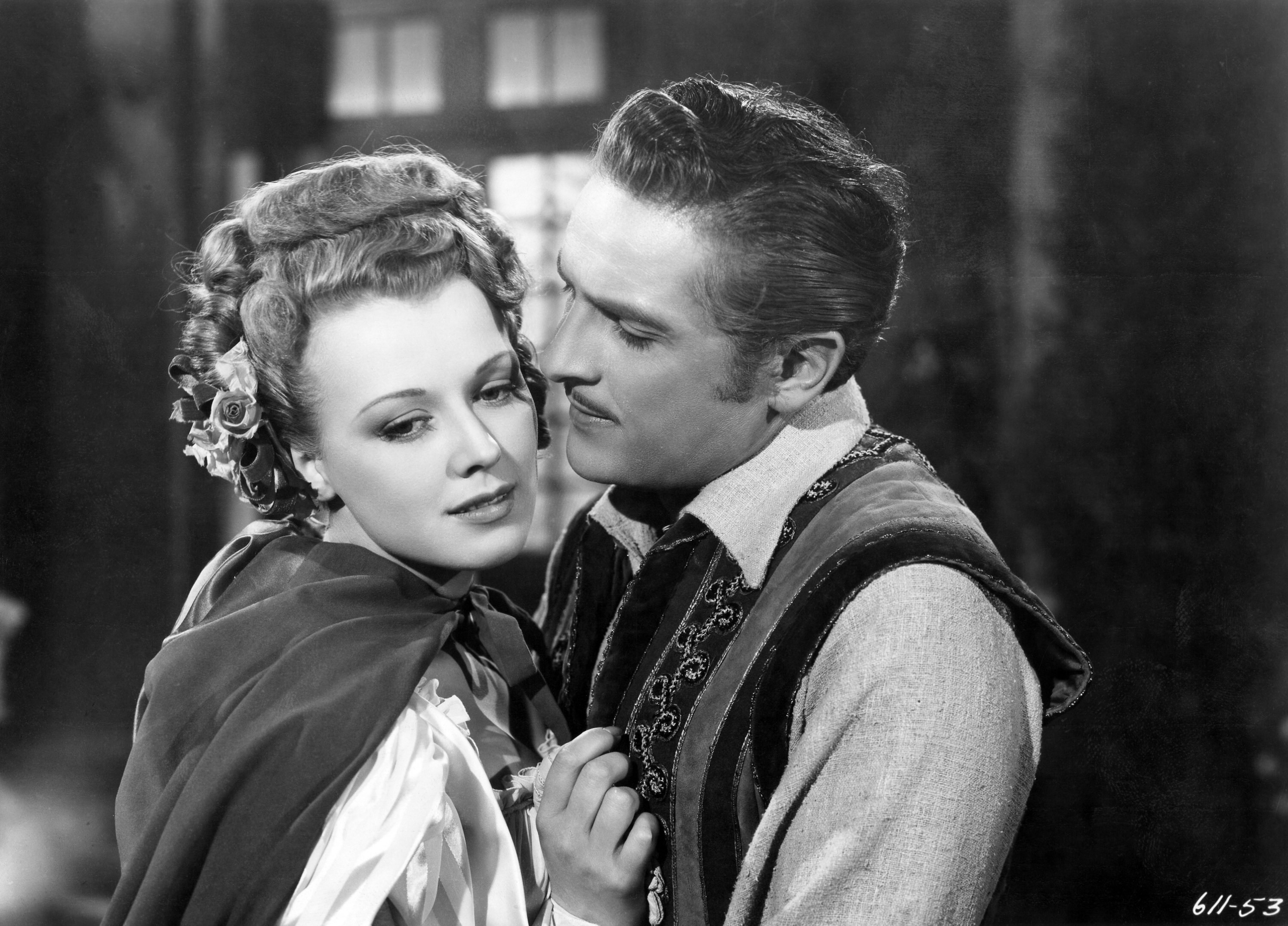 Man embracing a woman