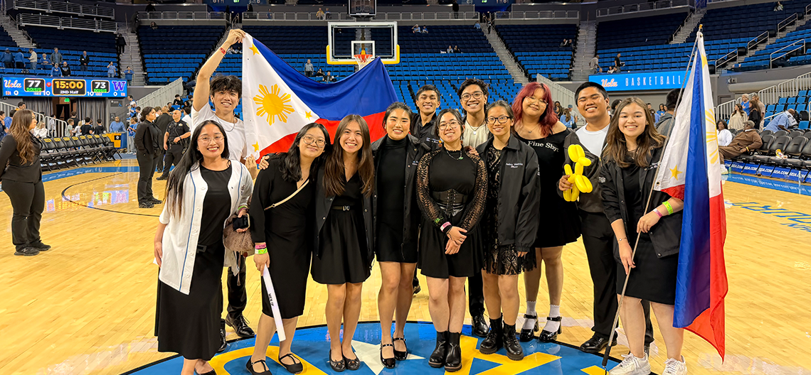 a group of performers pose together 