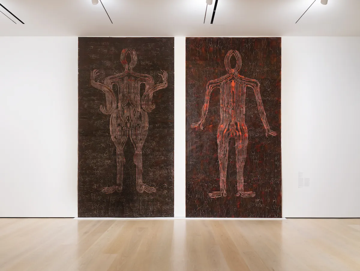 Two large abstract paintings of human shapes.