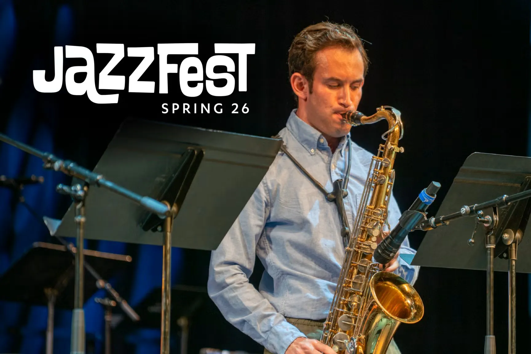 A jazz saxophone player on stage with white font "JazzFest Spring 26". 
